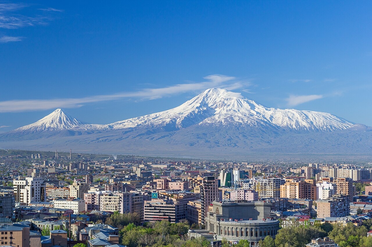 Mount Ararat rising above the plains of eastern Turkey, snow-covered dormant volcanic summit with a town in the foreground