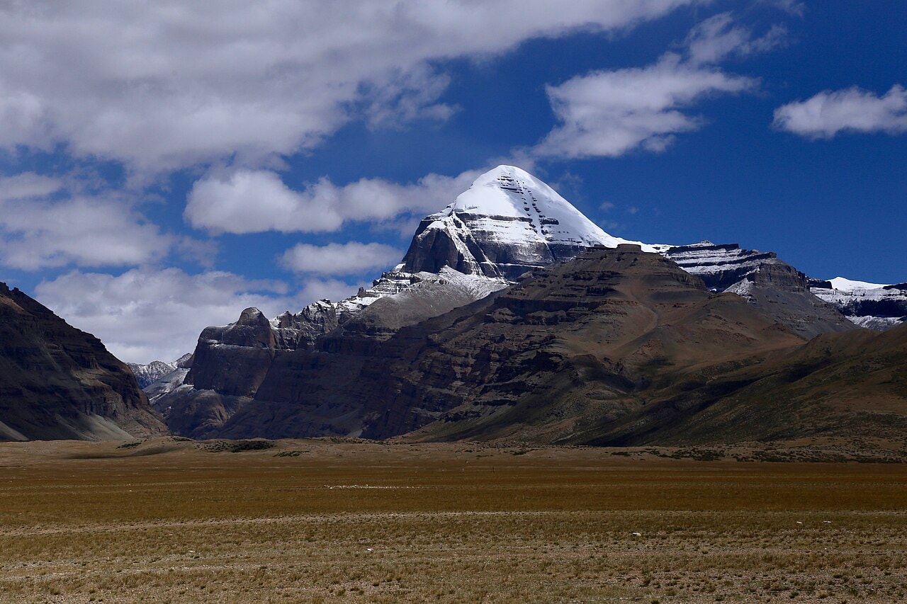 Mount Kailash, the black snow-streaked pyramid of western Tibet, rising above the barren Gangdise range on the Tibetan Plateau
