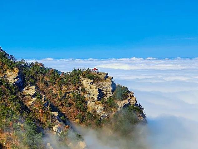 Mount Lu granite peaks in Jiangxi rising above a sea of clouds with a waterfall